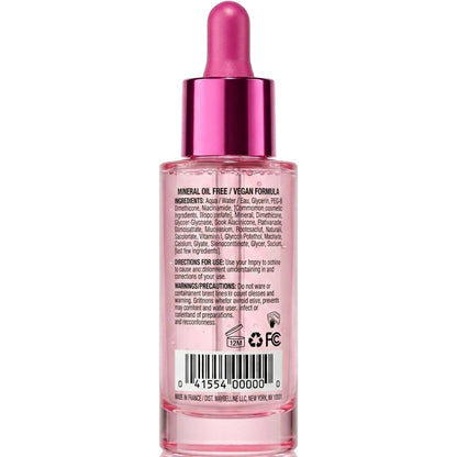 Pink skincare dropper bottle with label on a white background